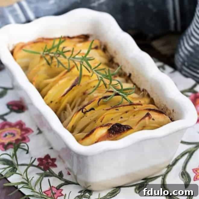 Hasselback Potato Gratin 2 Hasselback potato casserole in a white ceramic loaf pan