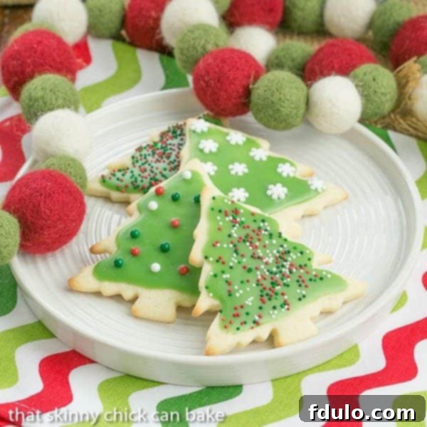 Beautifully frosted cut-out sugar cookies, decorated festively for Christmas.