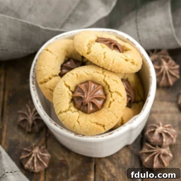 Peanut butter blossom cookies topped with chocolate stars, creating a Star of Bethlehem effect.