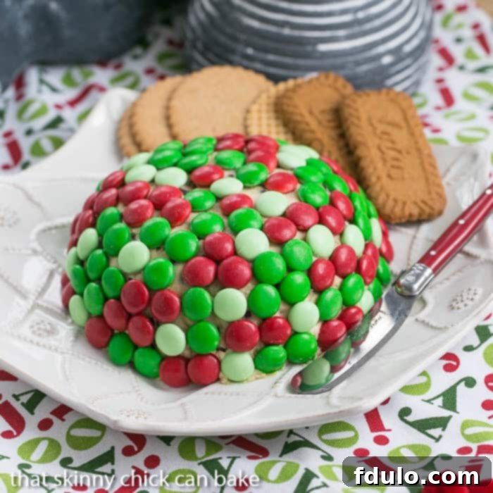 Cookie Dough Cheese Ball covered with holiday colored M & M's
