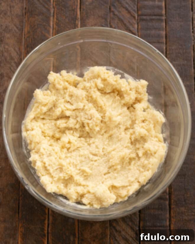 Gradually mix in flour and baking powder until just combined, avoid overmixing.