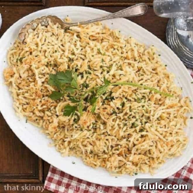 Spaetzel (German egg noodles) on a large serving platter, ready to be enjoyed as a side dish.