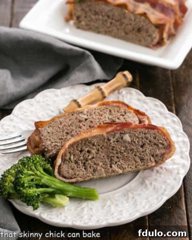 A plate with sliced meatloaf in front of a tray of meatloaf.
