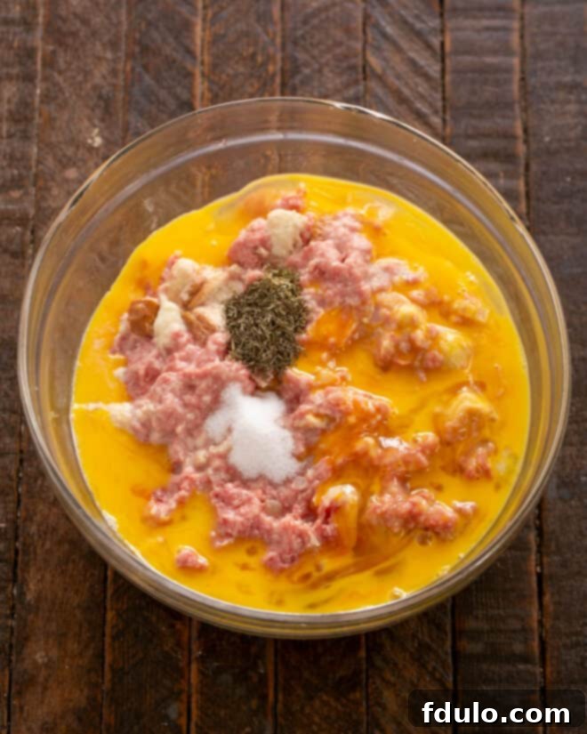 Eggs and seasonings added to meat mixture.