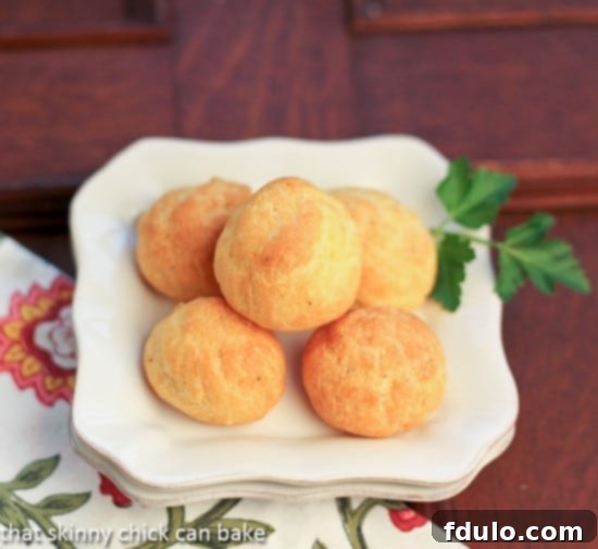 Overhead view of Parisian Cheese Puffs on a white plate