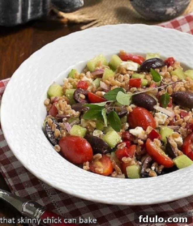 Greek Farro Salad from in a white basketweave bowl