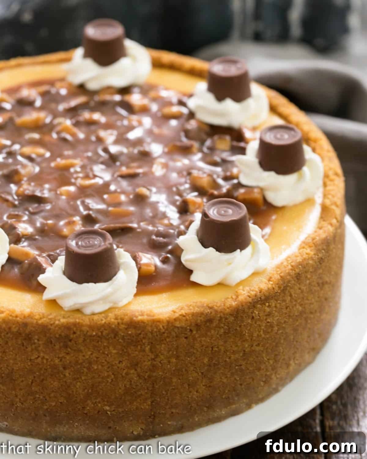 Close view of caramel cheesecake on a white serving plate.