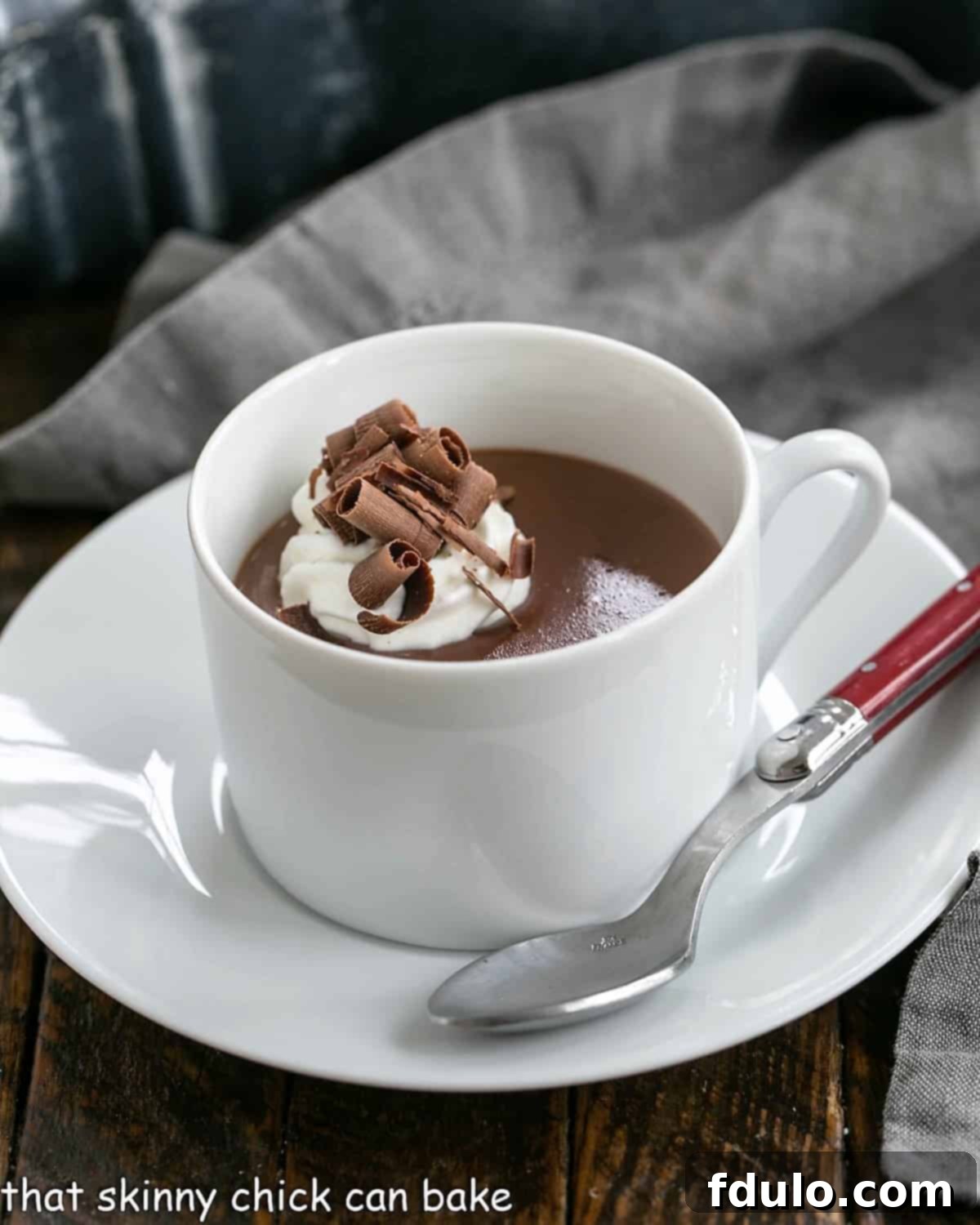 Luscious, thick Italian Hot Chocolate - This Cioccolata Calda is the BEST hot chocolate you'll ever make! Cup of Italian hot chocolate topped with whipped cream and chocolate shavings.
