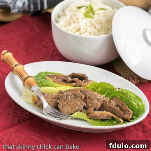 White platter of Easy Korean Beef Stir Fry, garnished with green onions.