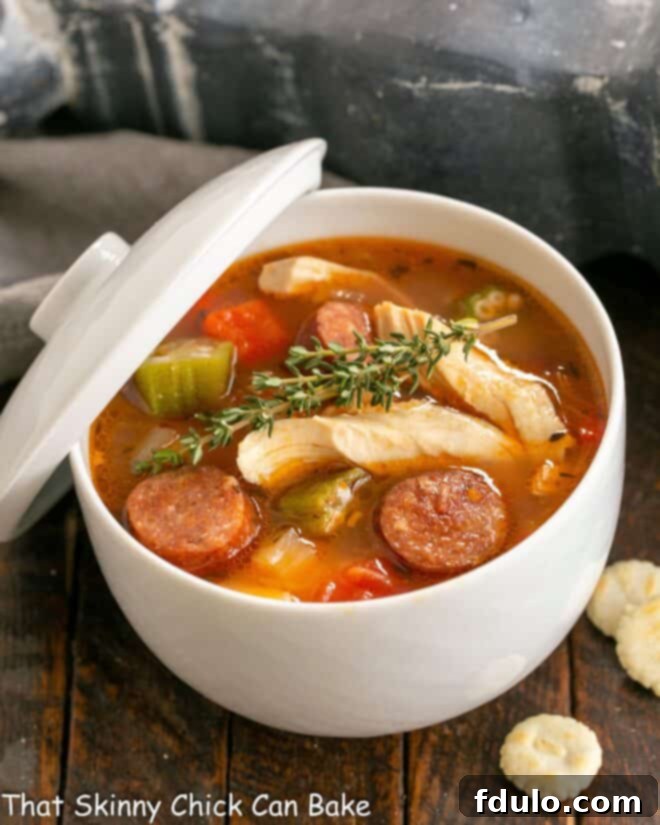 Jambalaya soup served in a elegant tureen with a lid, ready to be served.