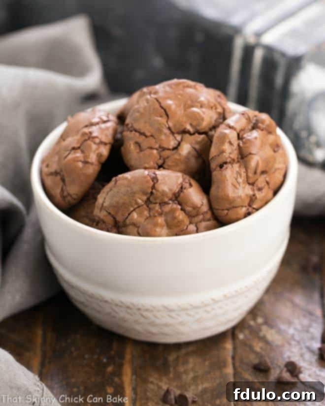 A bowl filled with freshly baked Chocolate Brownie Cookies with Mini Chocolate Chips, showcasing their fudgy texture.