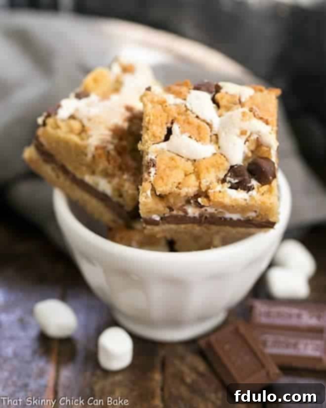 Step 10: Cooling the S'mores Cookie Bars completely, then carefully cutting them into neat squares for serving.