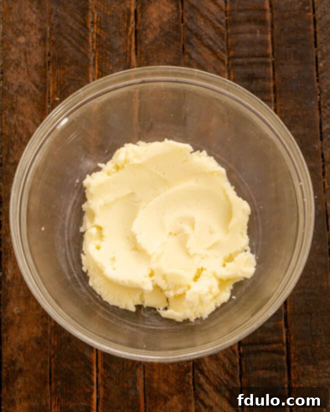 Step 1: Creaming softened butter and granulated sugar together in a mixing bowl until the mixture is light and fluffy.
