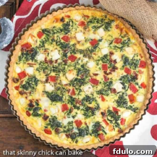 Sun-dried Tomato and Spinach Quiche - Overhead View of Unbaked Filling An overhead shot showcasing the vibrant filling of the Sun-dried Tomato and Spinach Quiche before baking, highlighting the colorful ingredients.