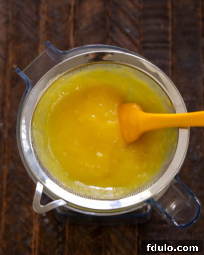 Step 6: Make the lemon custard over a double boiler, then strain it.