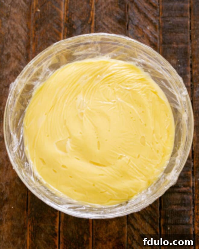 Step 9: Scrape the lemon filling into a bowl, press plastic wrap over the surface, and chill for at least 4 hours.