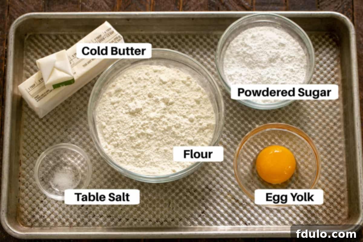 Lemon Tart Crust Ingredients displayed on a sheet pan with labels, ready for preparation.