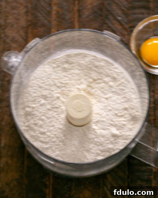 Step 1: Mix dry crust ingredients in a food processor.