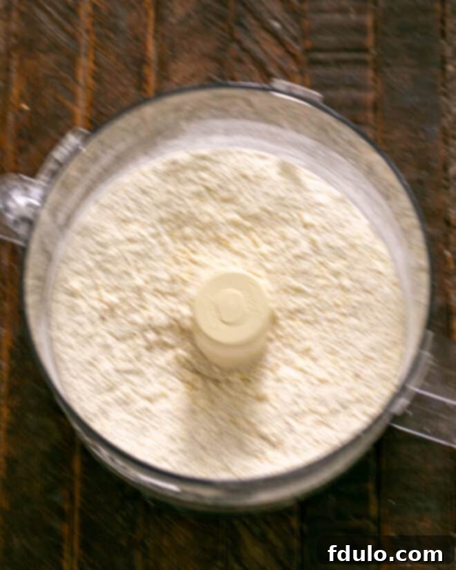 Step 2: Pulse to mix butter, then egg. Process to form dough for the tart crust.