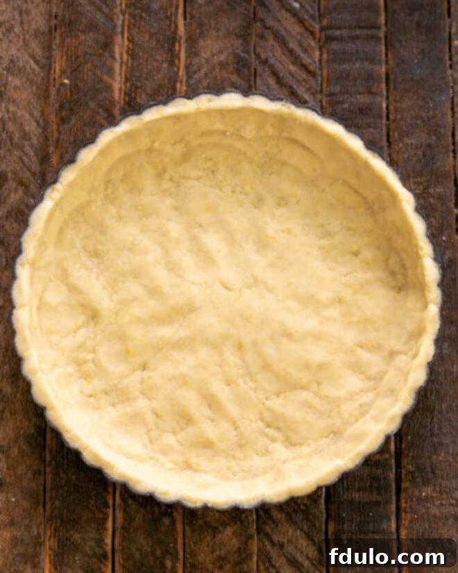 Step 3: Press the prepared crust dough into a tart pan.