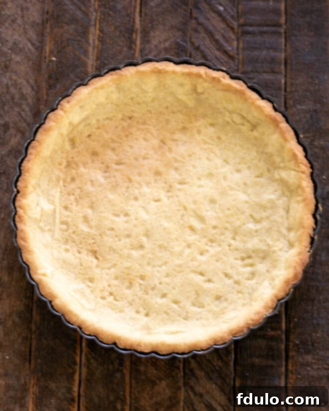 Step 4: Bake the tart crust until golden brown and set.