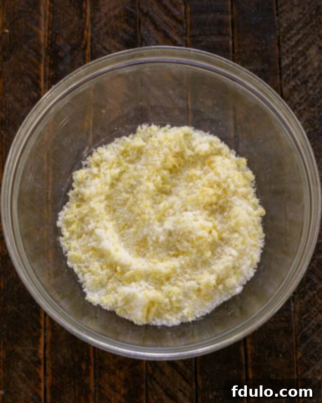 Step 5: Mix lemon zest into sugar, rubbing it to release oils.