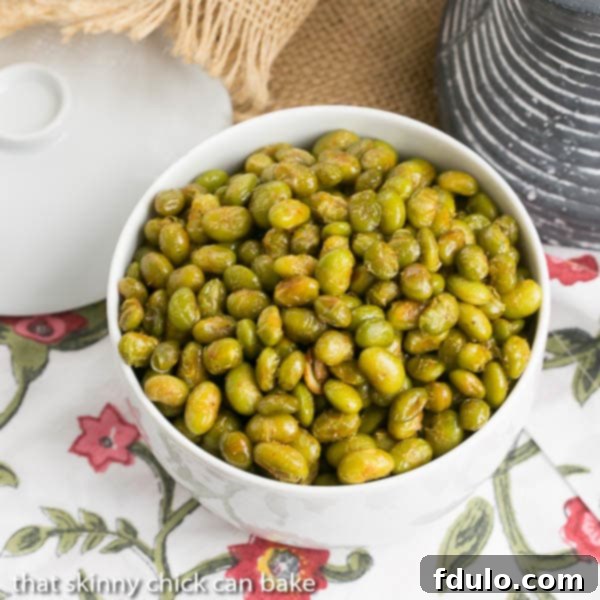 Roasted Creole Edamame in a white bowl viewed from above, perfectly seasoned.