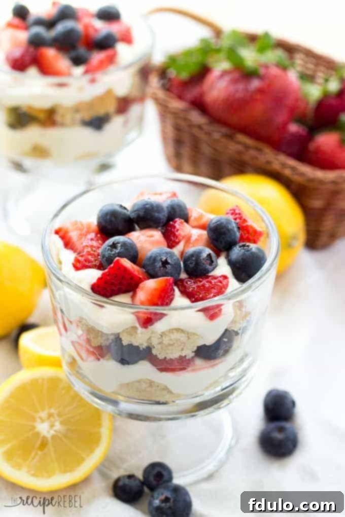 Lemon Berry Cheesecake Trifles, individual desserts layered with creamy cheesecake and fresh berries.