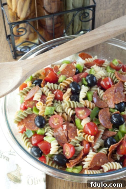 Classic Italian Pasta Salad, colorful and packed with fresh vegetables and Italian dressing.