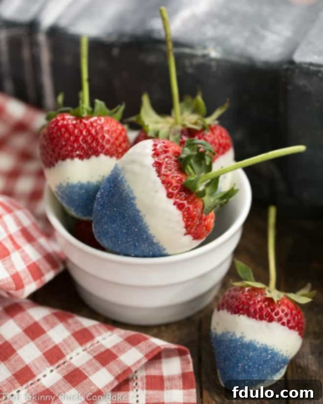 Red, White and Blue Strawberries dipped in white chocolate and blue sugar for a patriotic treat.