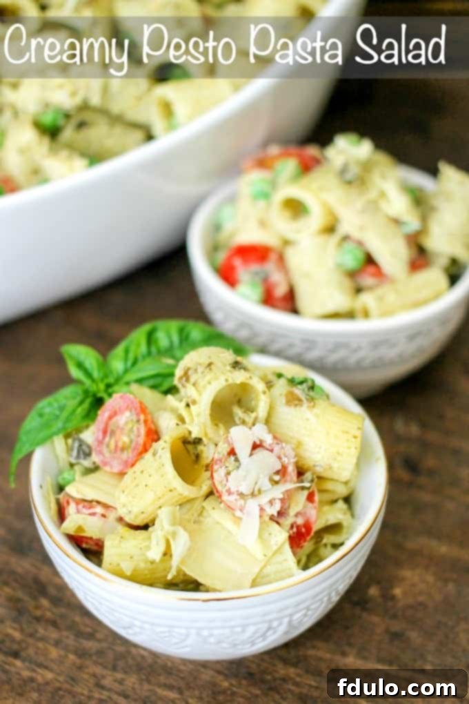 Creamy Pesto Pasta Salad loaded with fresh ingredients, perfect for picnics and BBQs.