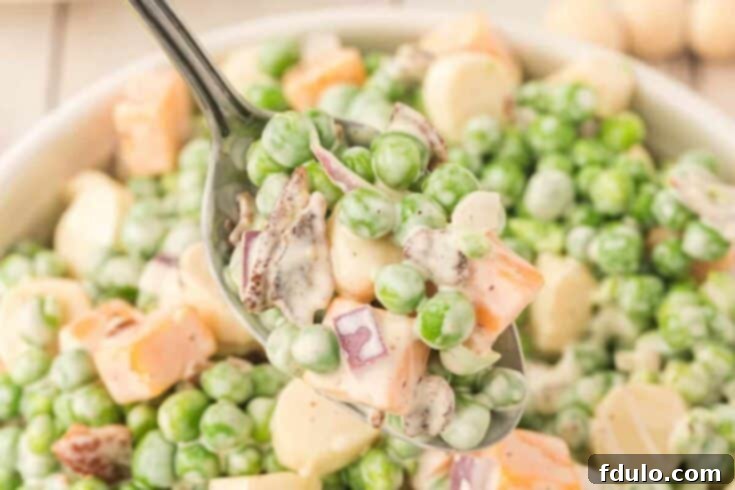 Classic Creamy Pea Salad, a beloved retro side dish perfect for gatherings.