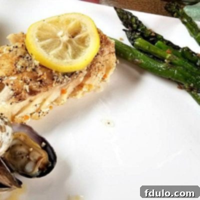 White Wine Steamed Clams served with cooked cod fillet and asparagus