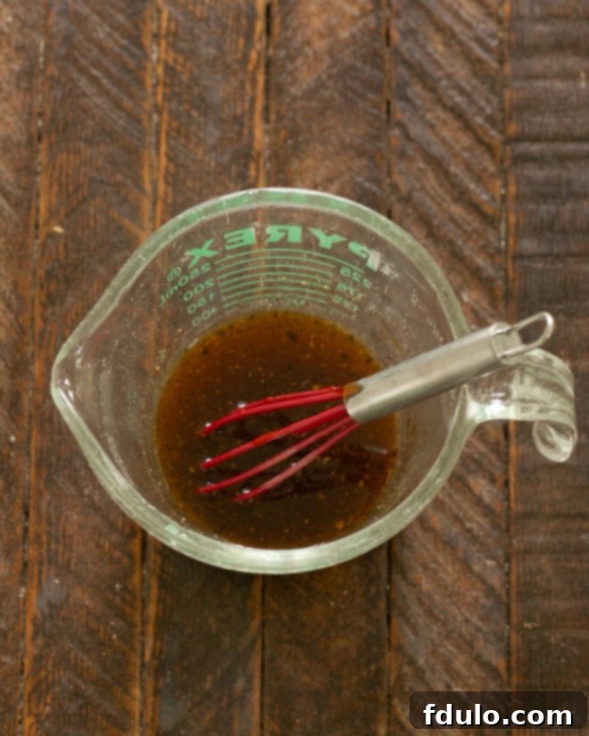 Ingredients for the stir fry sauce being mixed in a bowl.