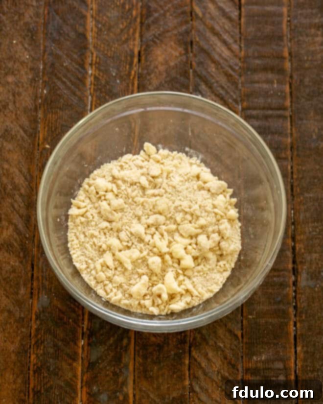 Step 11: Butter rubbed into dry ingredients to form streusel crumbs.