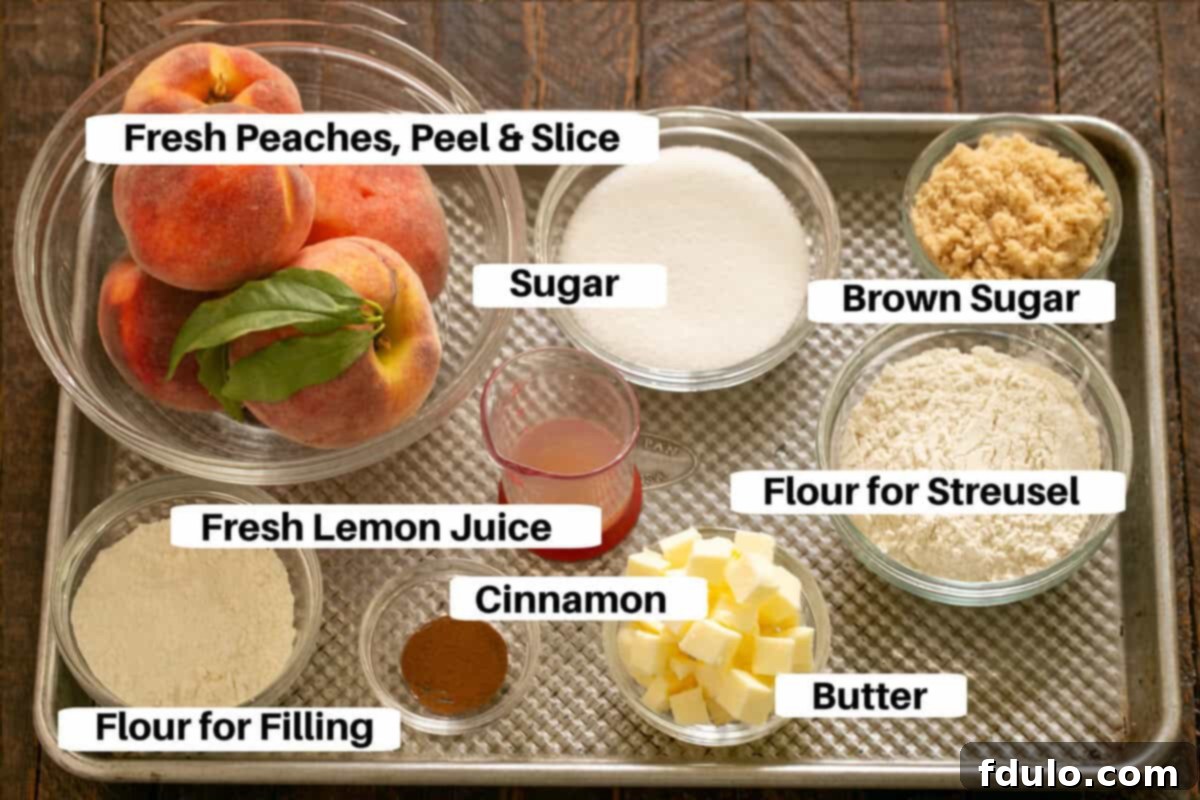 Peach Tart Filling and Streusel Ingredients with labels on a metal sheetpan, featuring sliced peaches, lemon, flour, sugar, brown sugar, cinnamon, and butter.