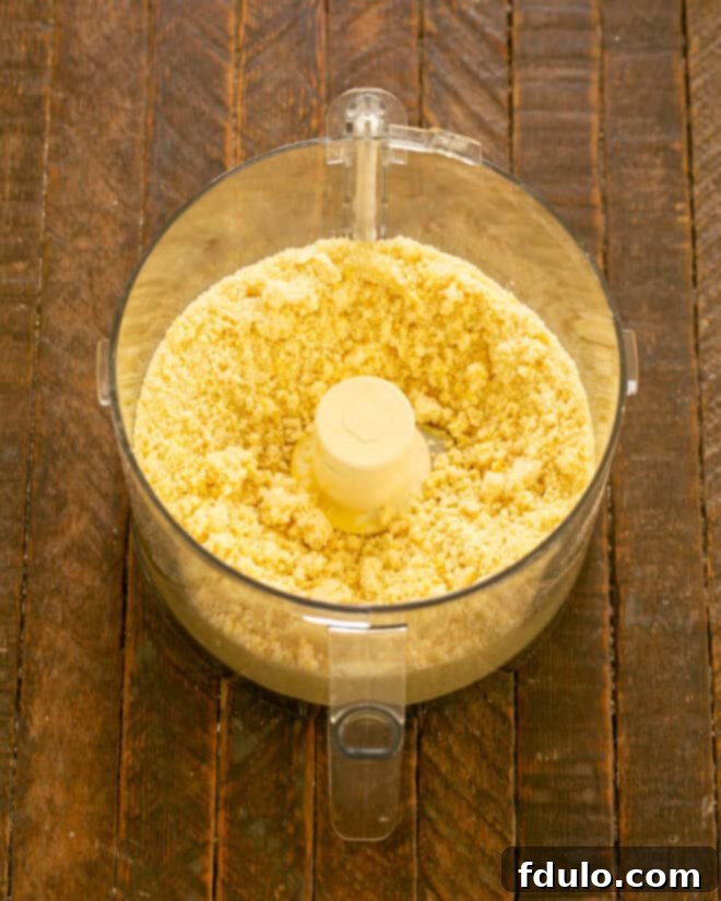 Step 2: Cold butter pulsed into dry ingredients until pea-sized.