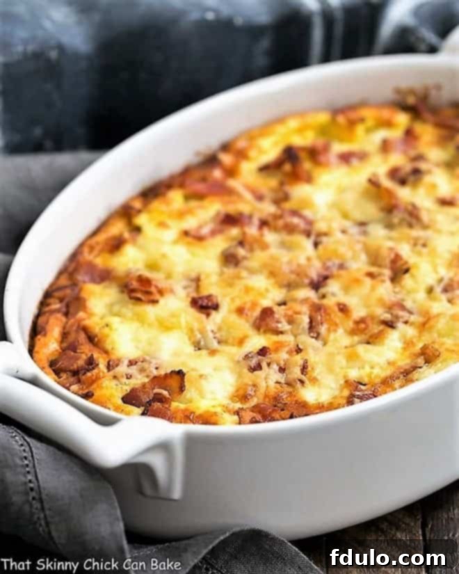 A delicious cauliflower bacon gratin baking in a white casserole dish.