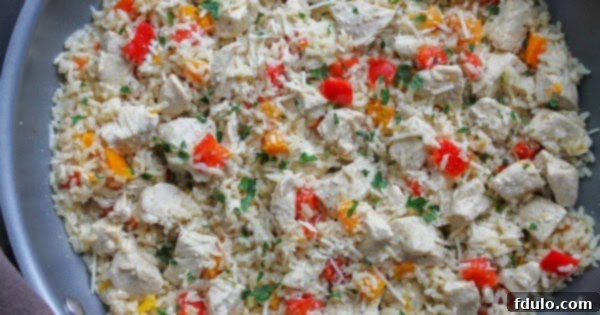 Beloved Chicken Dishes 12 One Pan Lemon Chicken & Rice with chicken pieces, rice, and herbs cooked together.