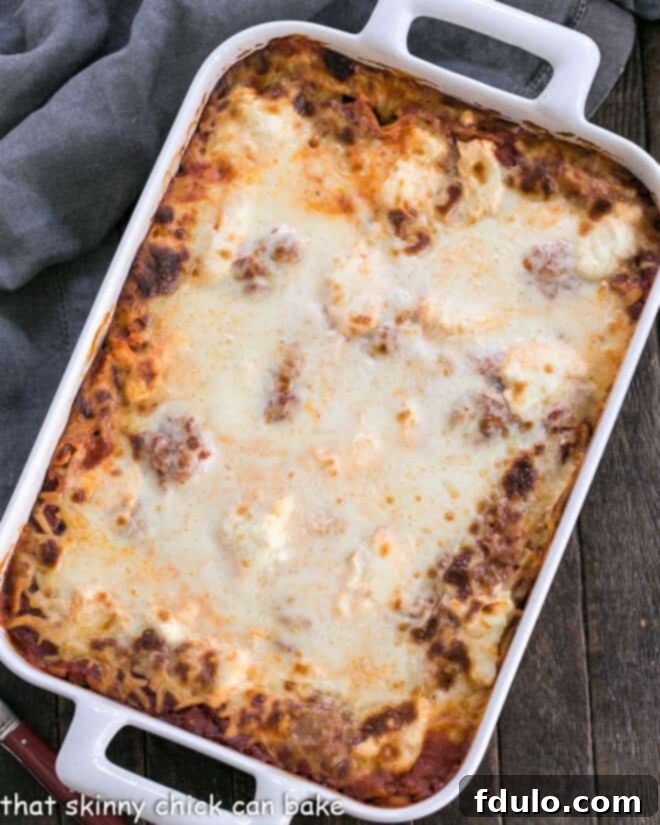 Ricotta Lasagna with Sausage in a white rectangular baking dish.