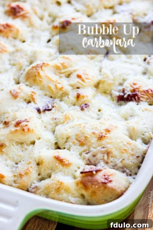 Effortless School Year Meals 19 Bubble Up Carbonara, a hearty casserole made with biscuit dough, bacon, and creamy sauce.