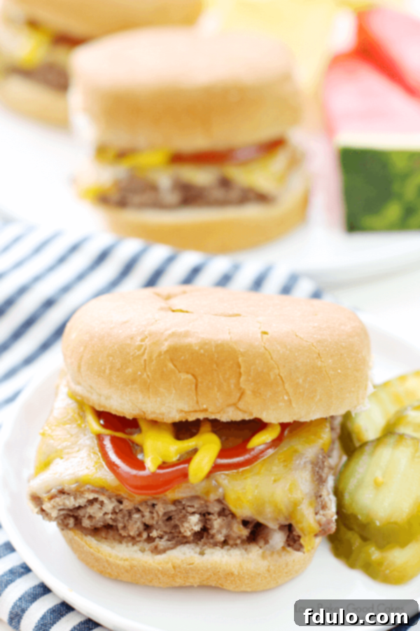 Effortless School Year Meals 23 Easy Beef Sliders arranged on a serving platter with cheese and toppings.