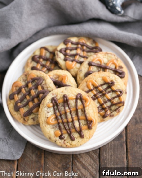 Irresistible Toffee Cookies with Walnuts, Caramel, and Chocolate Drizzle Golden-brown Toffee Cookies with walnuts, caramel, and chocolate drizzle on a white plate, ready to be enjoyed.