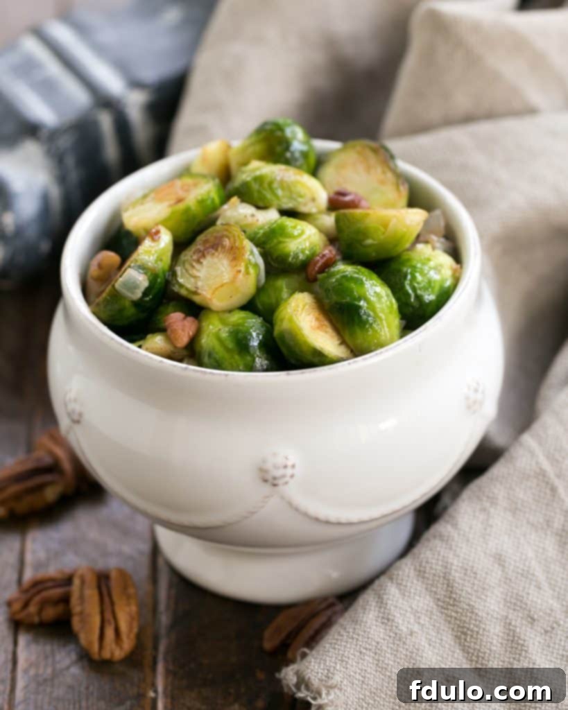 A white bowl of Brussels sprouts