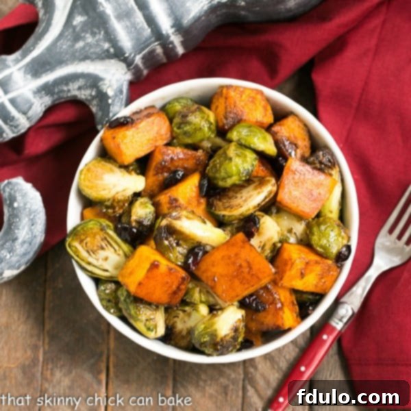 Autumn Root Roast with Zesty Dijon Drizzle 7 Roasted Autumn Vegetables | Squash, Brussels sprouts and dried cranberry party together for a magnificent side dish!