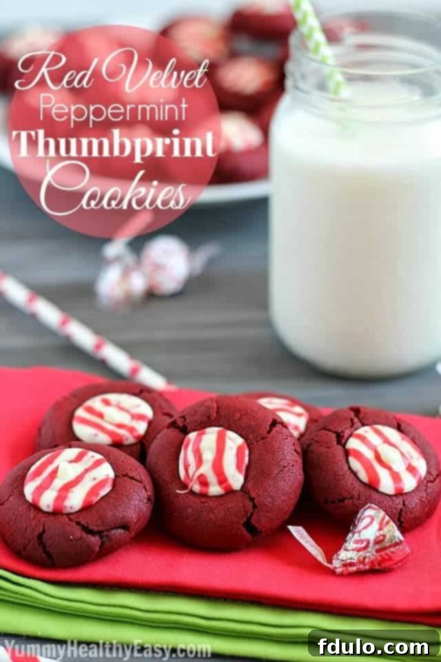 Red Velvet Thumbprints, vibrant red cookies with a peppermint filling, perfect for Christmas.