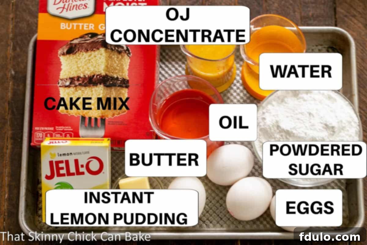 All the essential ingredients for making an Easy Lemon Bundt Cake laid out on a sheet pan, clearly labeled for convenience.