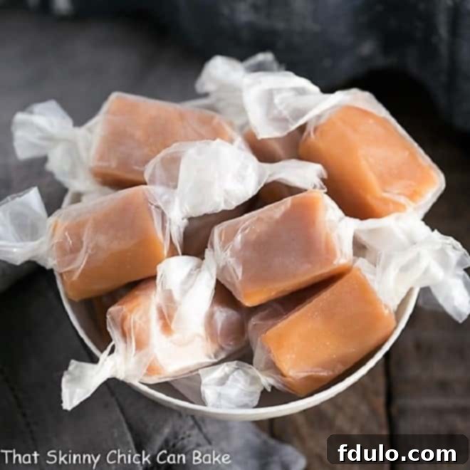 Soft Chewy Cream Caramels - These homemade caramels cannot be rivaled! And they freeze so you can make them ahead for the holidays! Soft Chewy Cream Caramels in a white candy bowl.