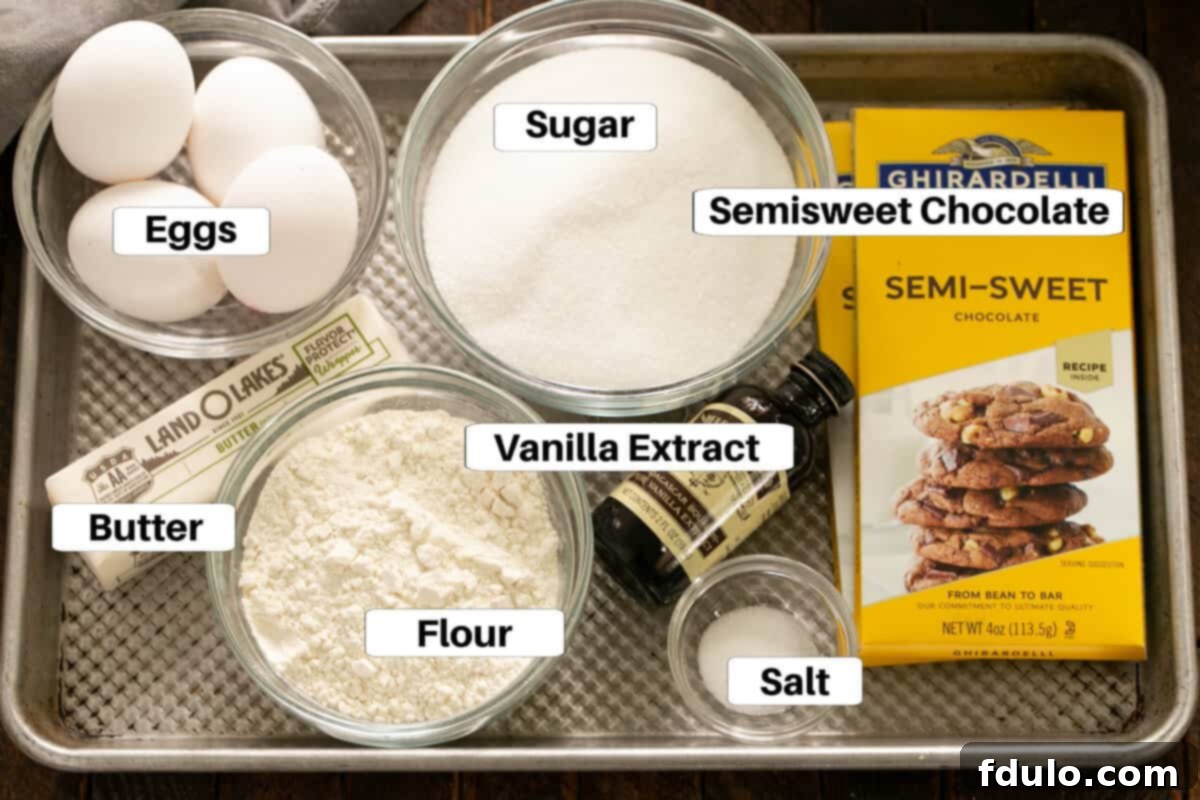 Fudgy brownies ingredients with labels on a metal sheetpan.