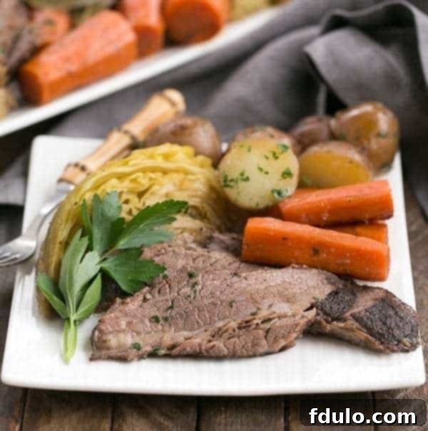 Hearty Irish Corned Beef and Cabbage 2 Irish Braised Corned Beef | Brisket slow cooked with the classic corned beef spices and vegetables for a tender, flavorful meal.